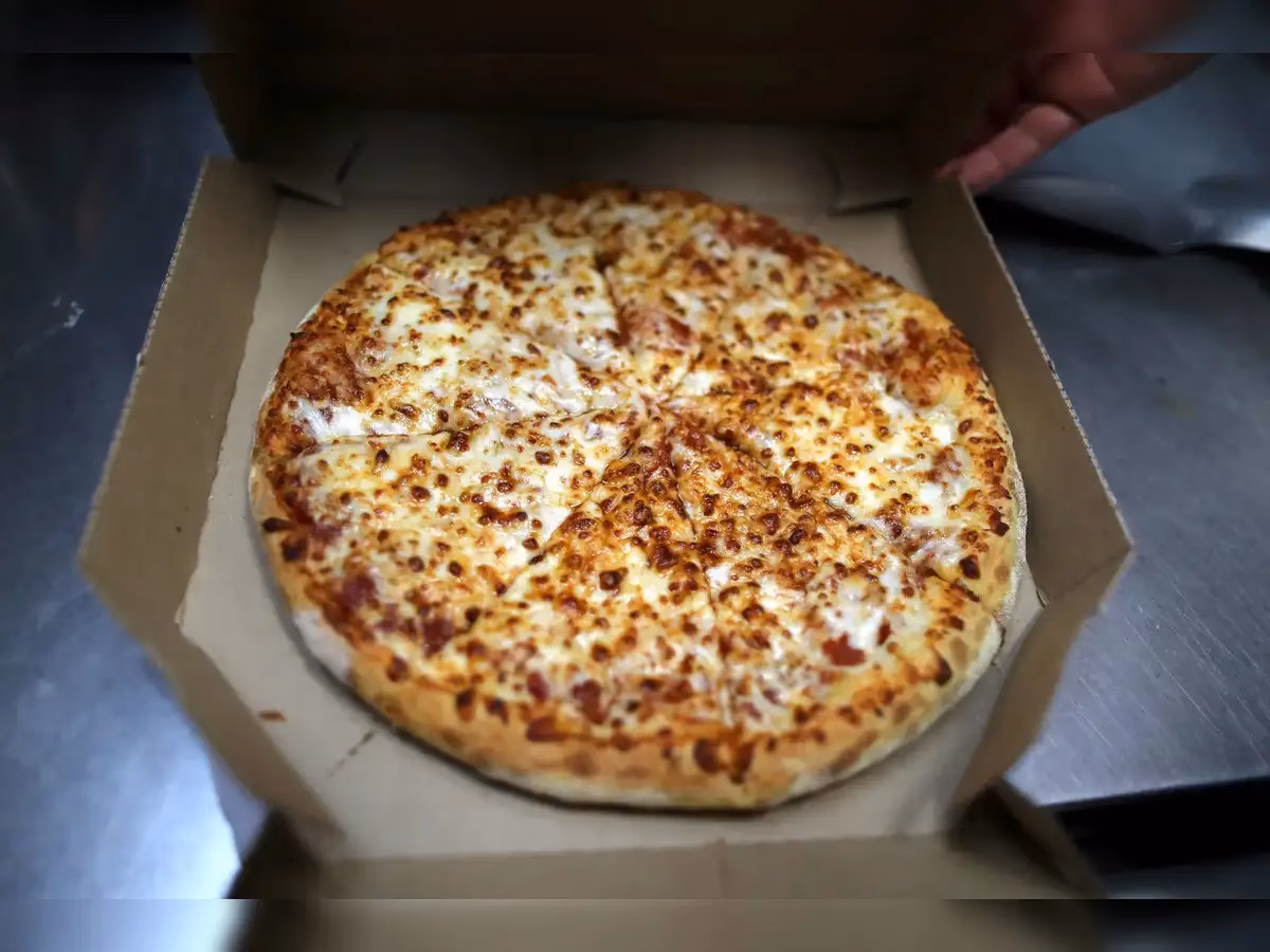 How much pizza do Americans eat a year?