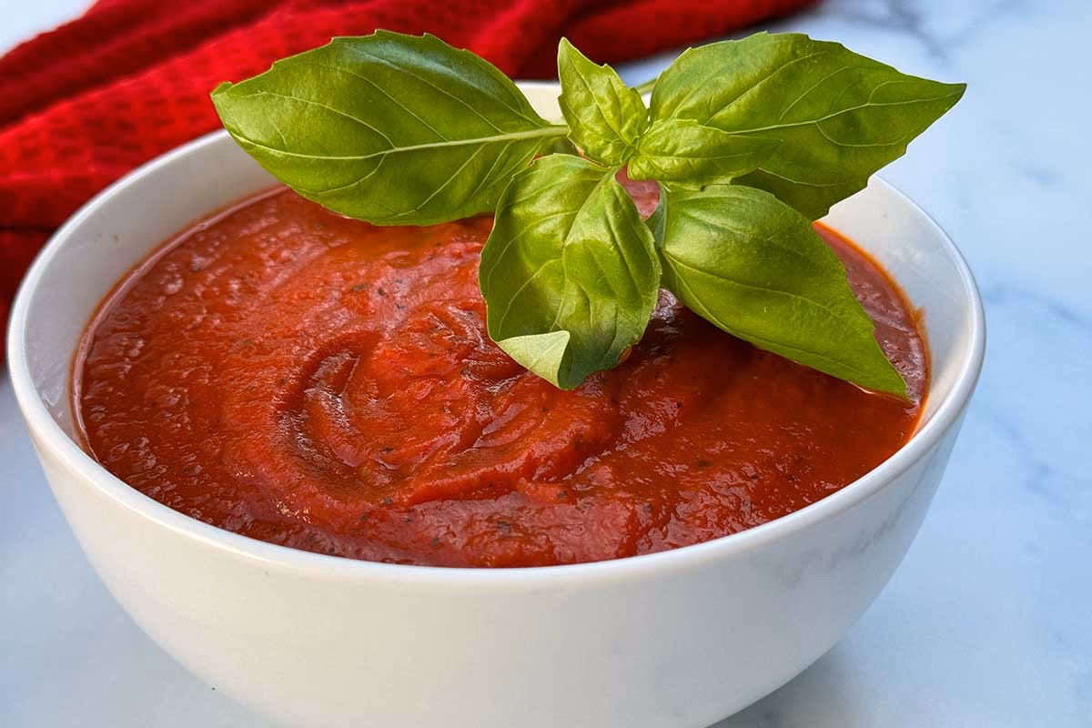 Is pizza sauce cooked or uncooked?