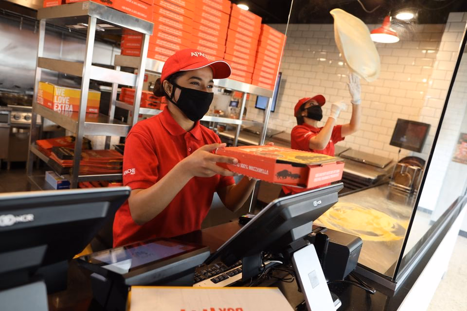 Who is the Managing Director of Apache Pizza?