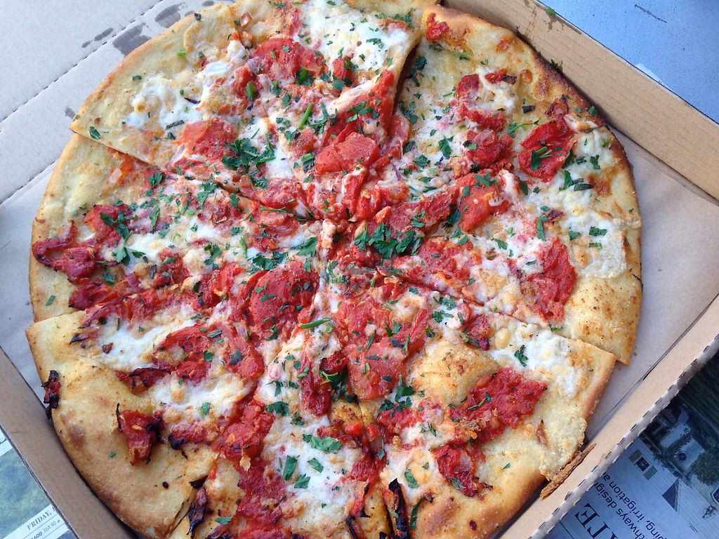 When is Cheese Board Collective pizzeria open?