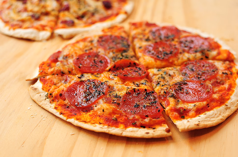 How do you make a cracker-style thin crust pizza?