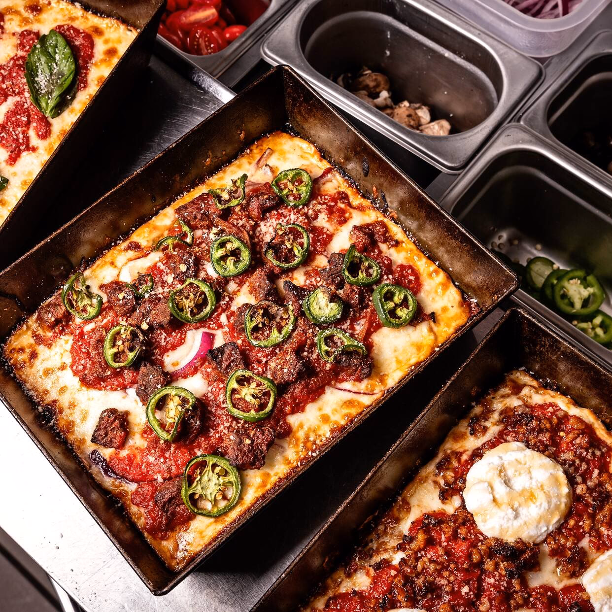 Where is Emmy squared Pizza located?