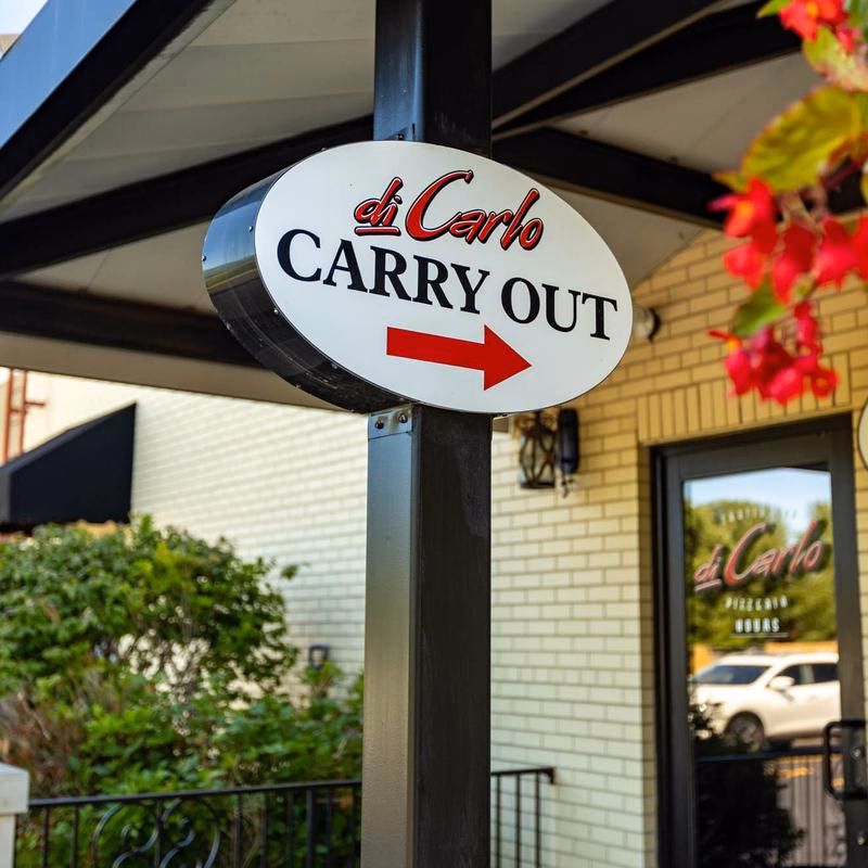 Why should you visit Trattoria Di Carlo & pizzeria?