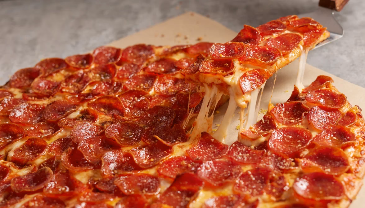 How do I view nutrition information on the Donatos menu?