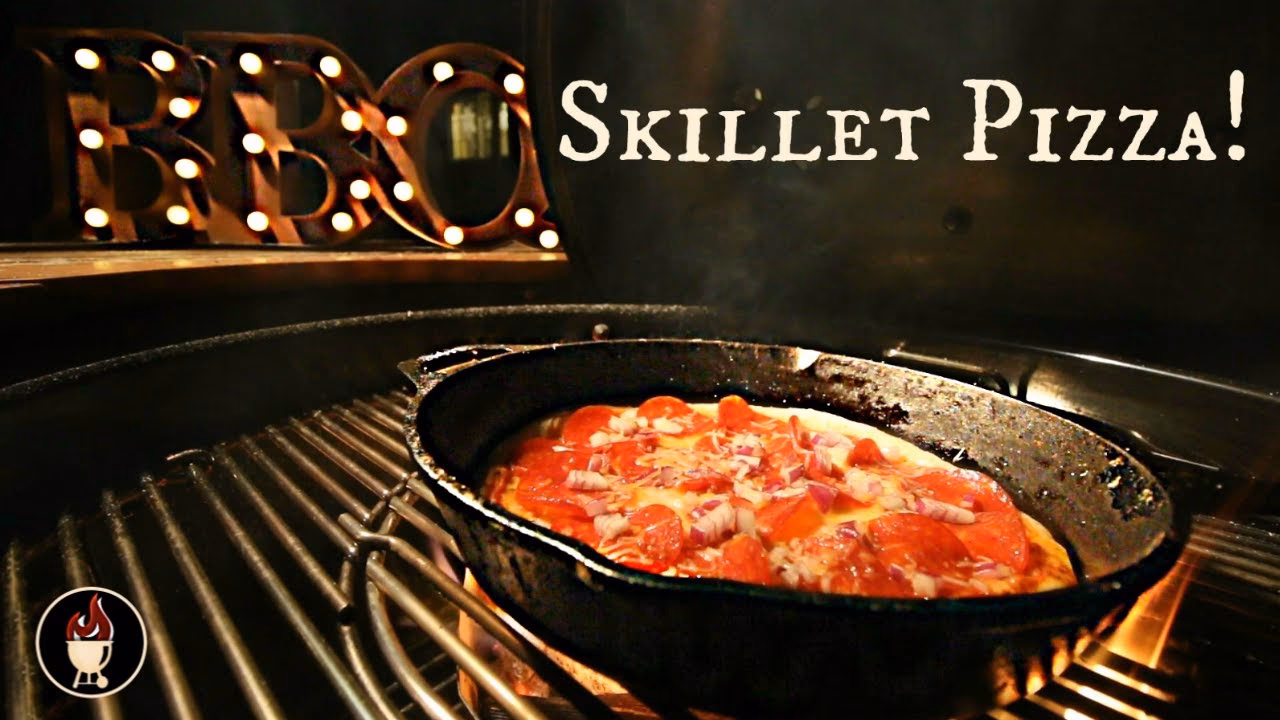 How do you cook pizza dough on a cast iron grill?