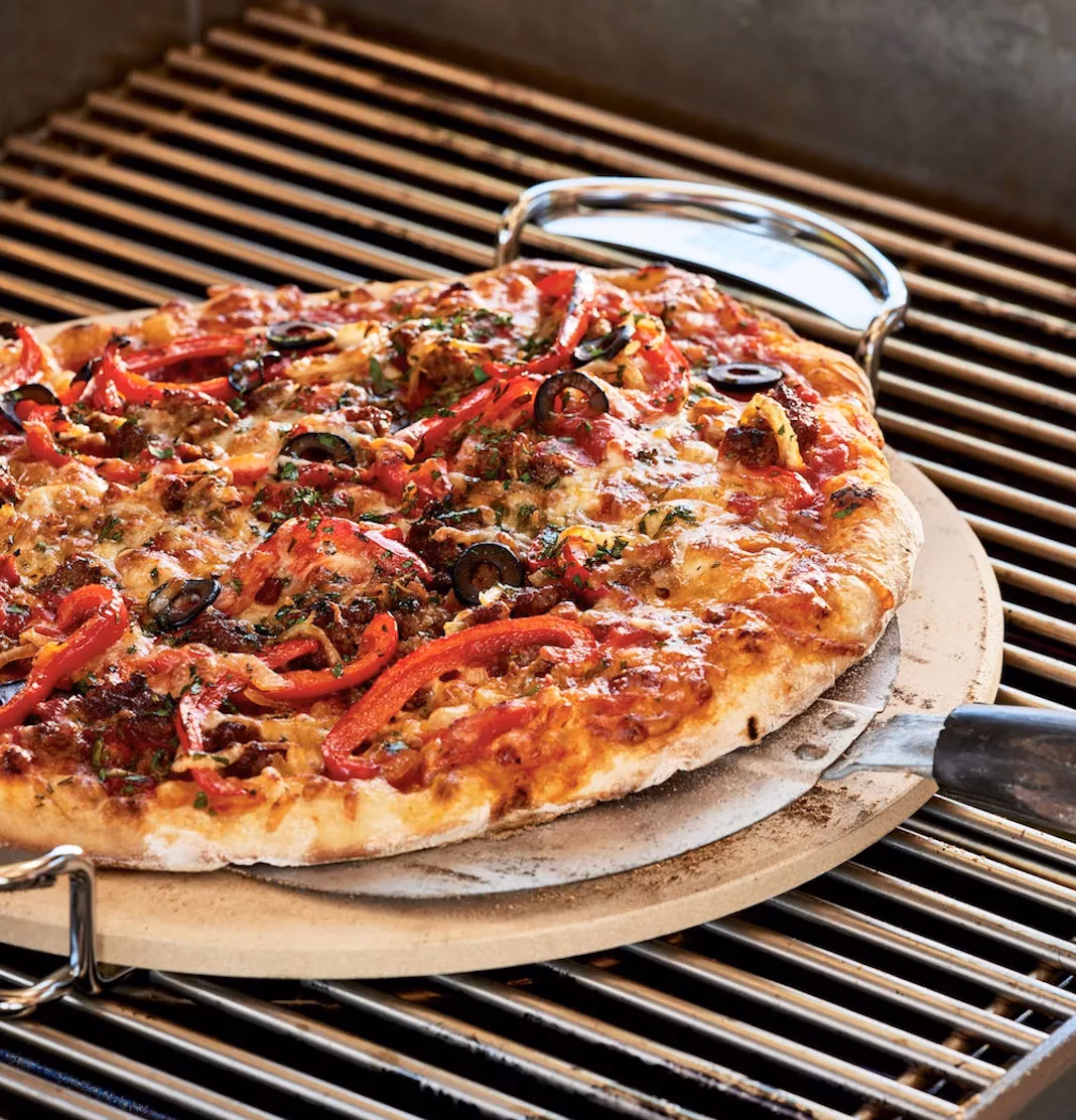 How do you cook a pizza stone on a Weber Q?