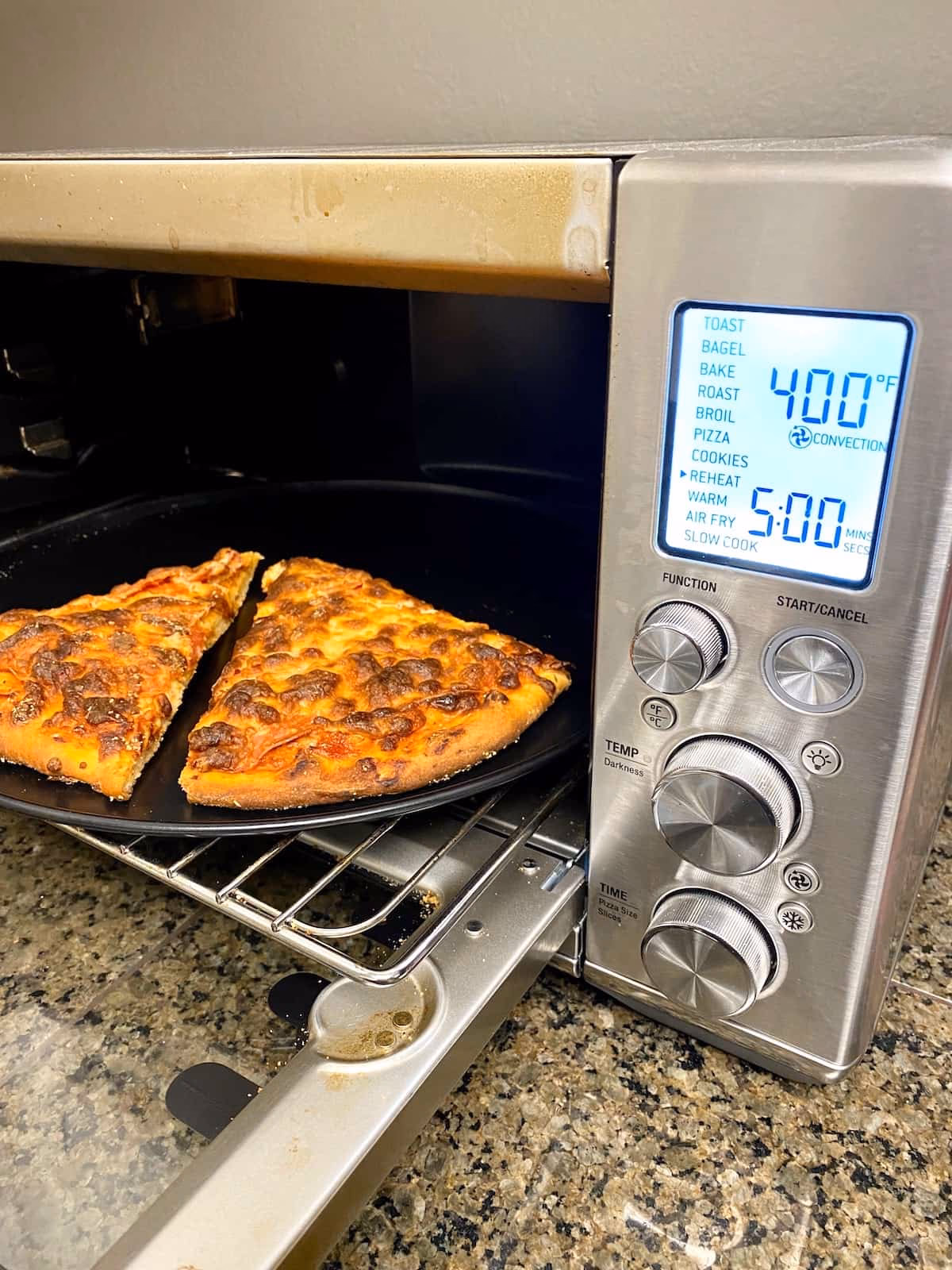 How do you reheat a pizza in a frying pan?