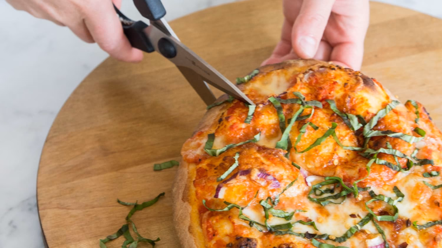 How do you cut a pizza with a knife?