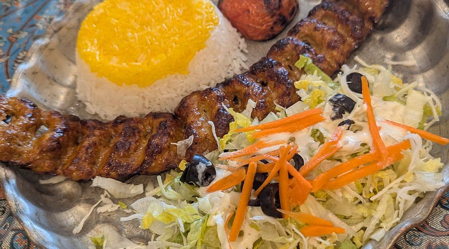 Who designed & developed Persepolis restaurant?