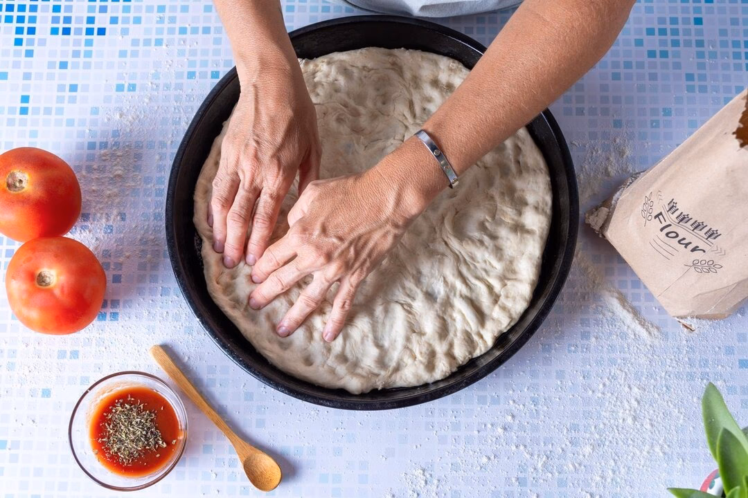 How do you keep a pizza from sticking?