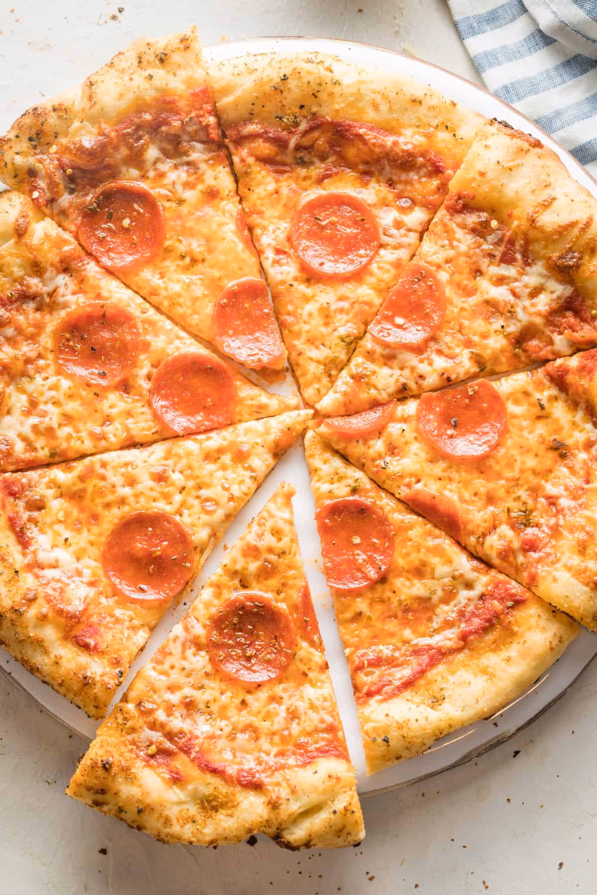 How do you make a pizza with mozzarella cheese & pepperoni?
