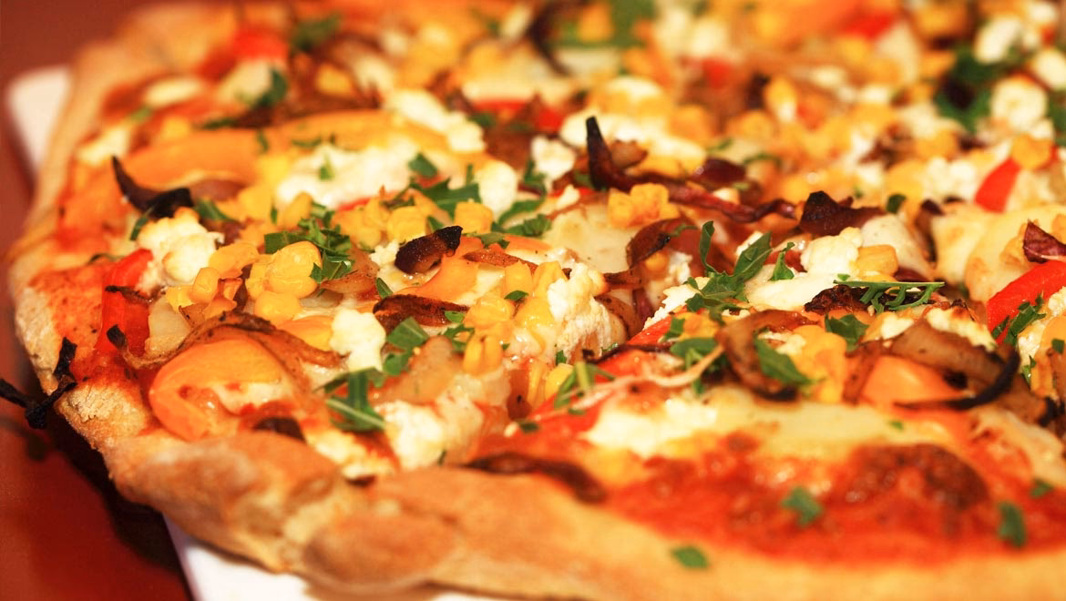 Wie werden Pizza-Spezialitäten zubereitet?