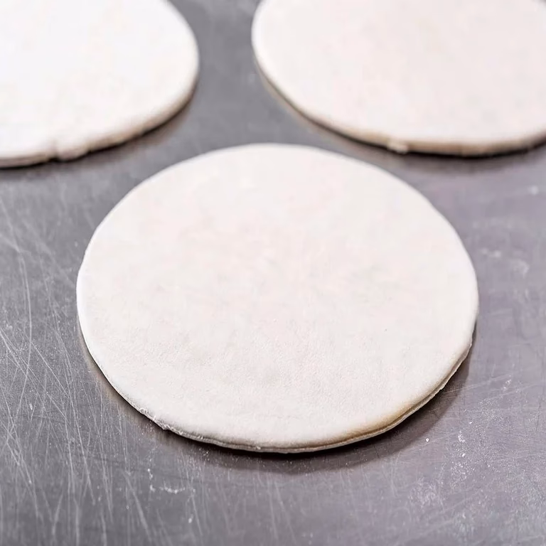 How to make a pizza crust using a dough sheeter?