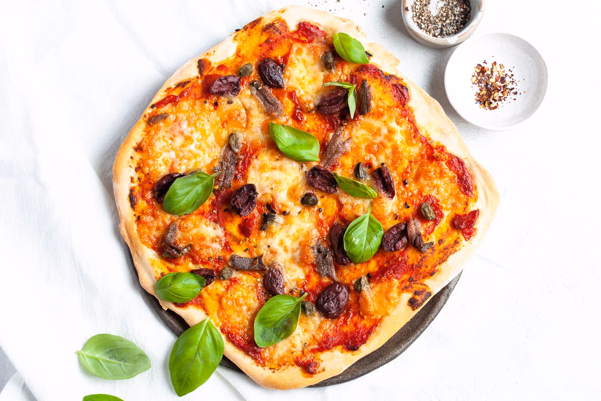 Who makes cheese-free Puttanesca pizza?