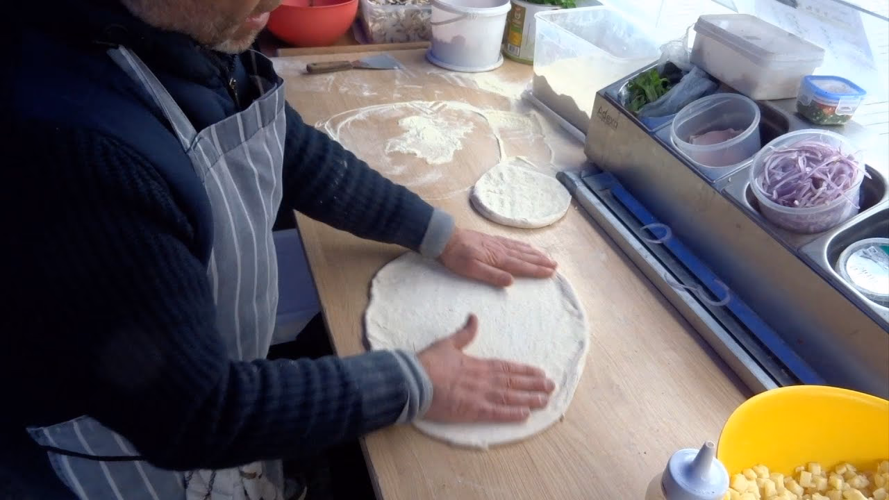 How do you shape a pizza?